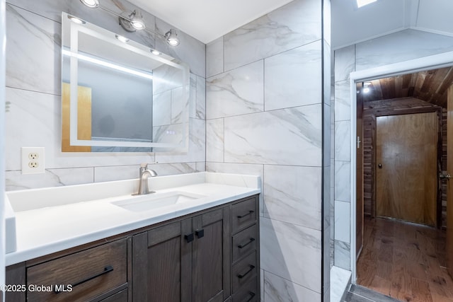 1258 Hawthorn Rd, Niskayuna, NY 12309 - bathroom featuring vanity, wood finished floors, and tile walls