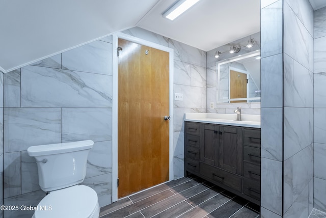 1258 Hawthorn Rd, Niskayuna, NY 12309 - bathroom featuring tile walls, vanity, and toilet
