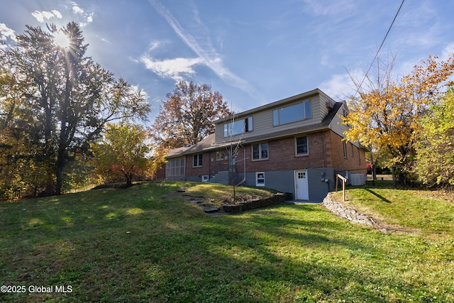 1258 Hawthorn Rd, Niskayuna, NY 12309 - back of property featuring brick siding and a lawn