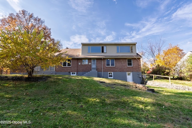 1258 Hawthorn Rd, Niskayuna, NY 12309 - back of property featuring brick siding and a yard