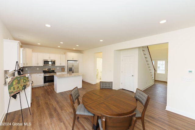 dining room with dark wood-type flooring