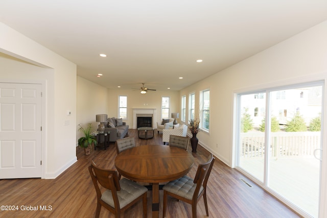 dining space featuring dark hardwood / wood-style floors and ceiling fan