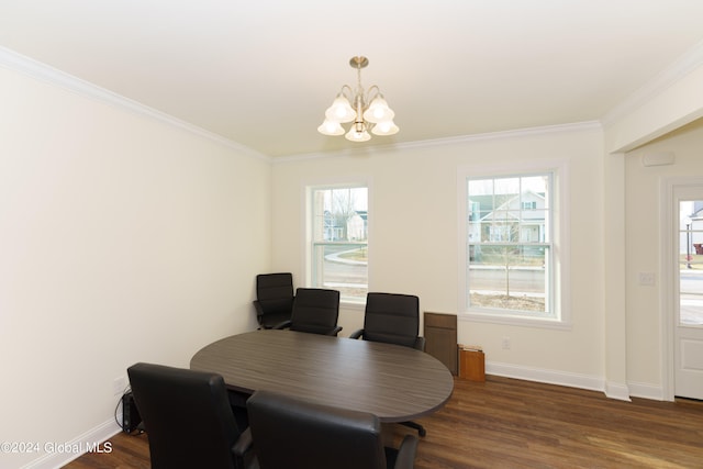 dining room featuring a notable chandelier, dark wood-type flooring, and ornamental molding