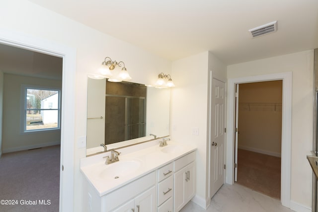 bathroom with vanity and walk in shower