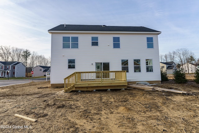 back of property featuring a deck