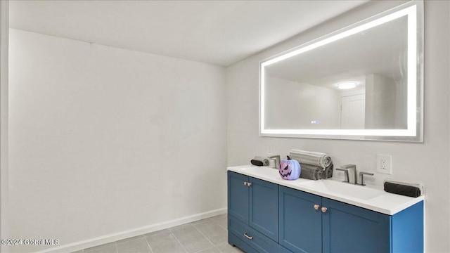 bathroom with vanity and tile patterned flooring