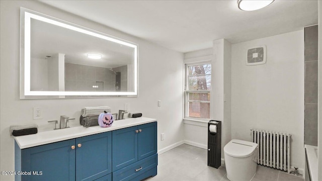 bathroom featuring toilet, radiator, vanity, and a tile shower