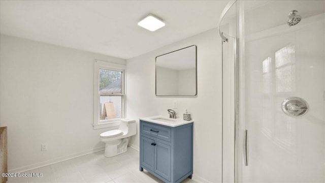 bathroom with vanity, toilet, and a shower