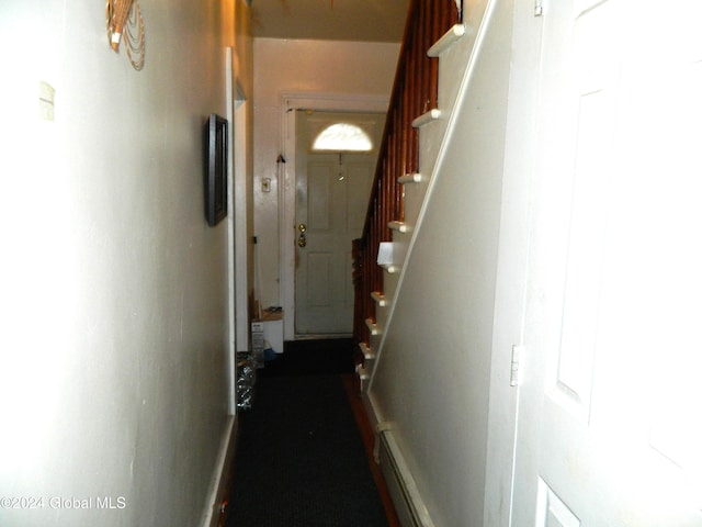 corridor with a baseboard heating unit