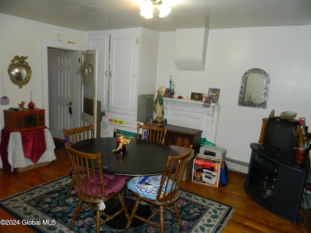 dining space with dark hardwood / wood-style floors