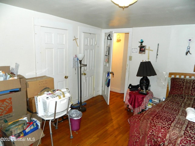 bedroom with hardwood / wood-style floors