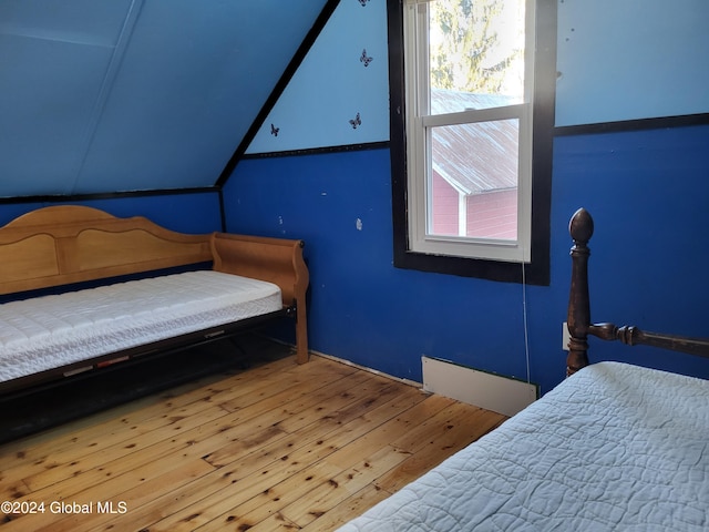 bedroom with hardwood / wood-style flooring