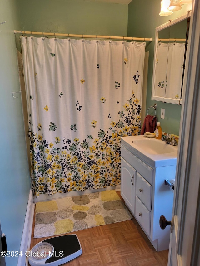 bathroom featuring vanity and parquet floors