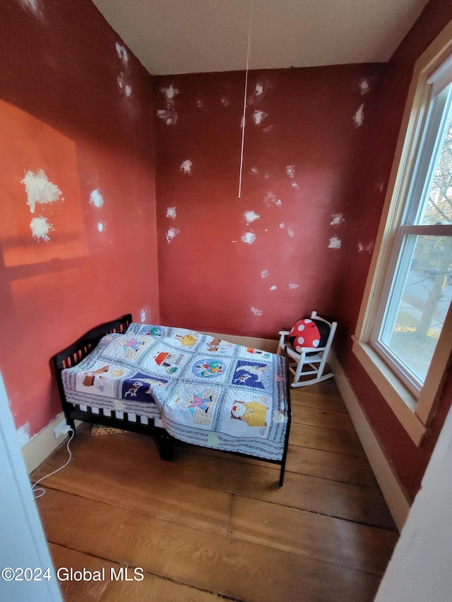 bedroom featuring wood-type flooring