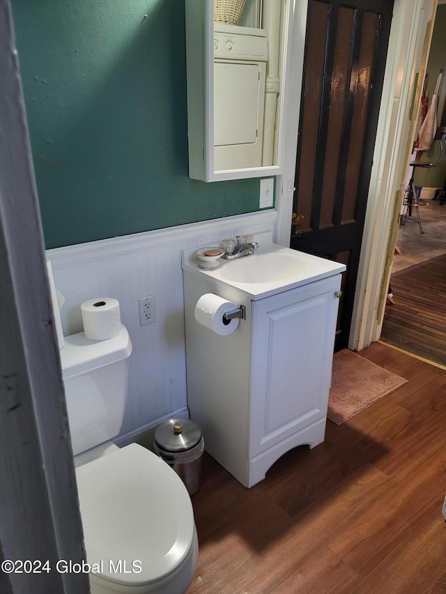 bathroom featuring hardwood / wood-style floors, vanity, and toilet