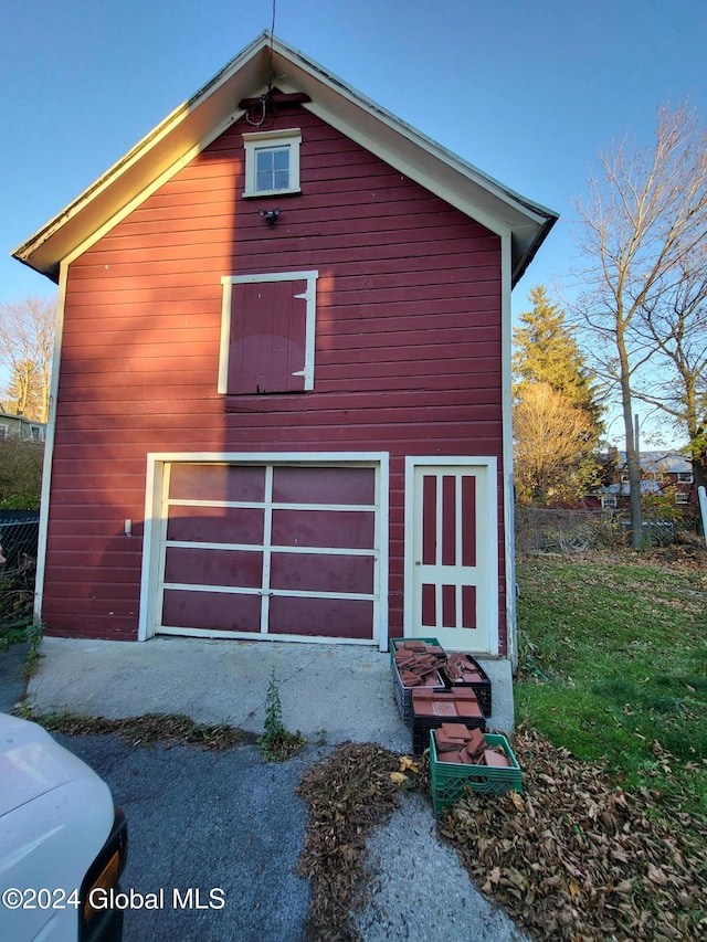 view of property exterior with a garage