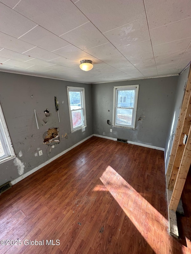 unfurnished room featuring wood-type flooring