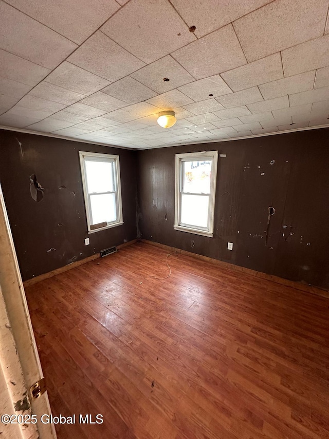 unfurnished room featuring hardwood / wood-style floors