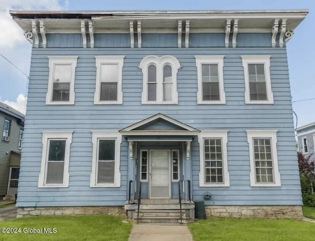 75 E Main St, Johnstown, NY 12095 - italianate-style house with a front lawn