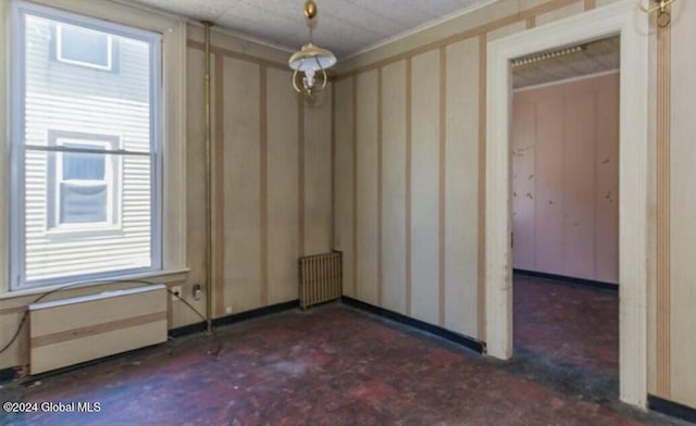 75 E Main St, Johnstown, NY 12095 - spare room featuring radiator and plenty of natural light