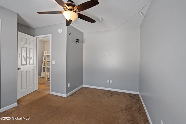 unfurnished bedroom with lofted ceiling, ceiling fan, and carpet