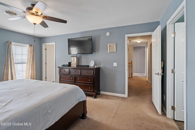 bedroom with ceiling fan and light carpet