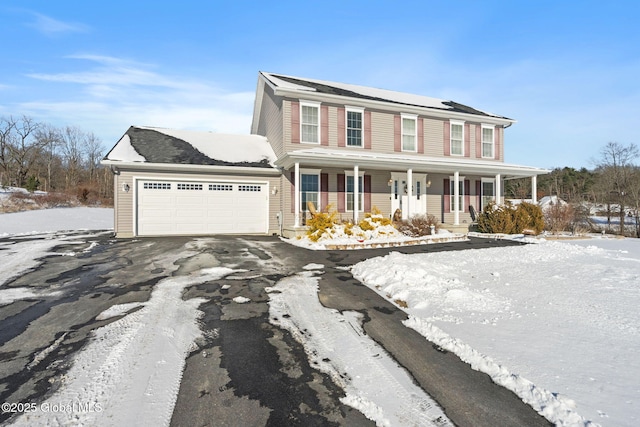 view of front of property with covered porch and a garage