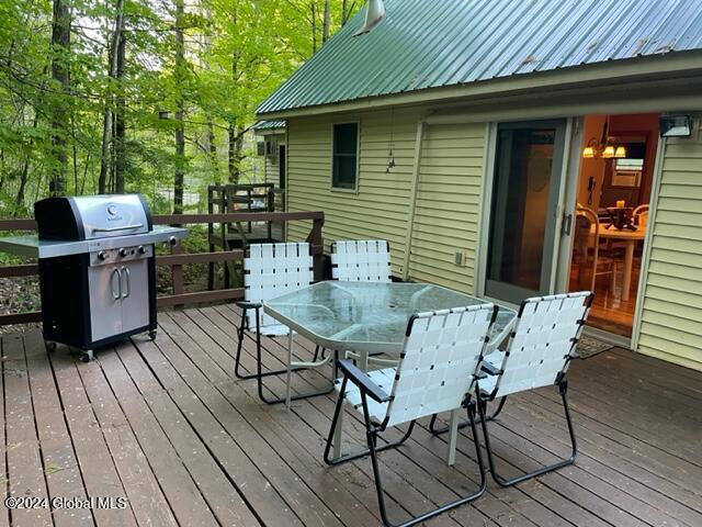 wooden deck with a grill