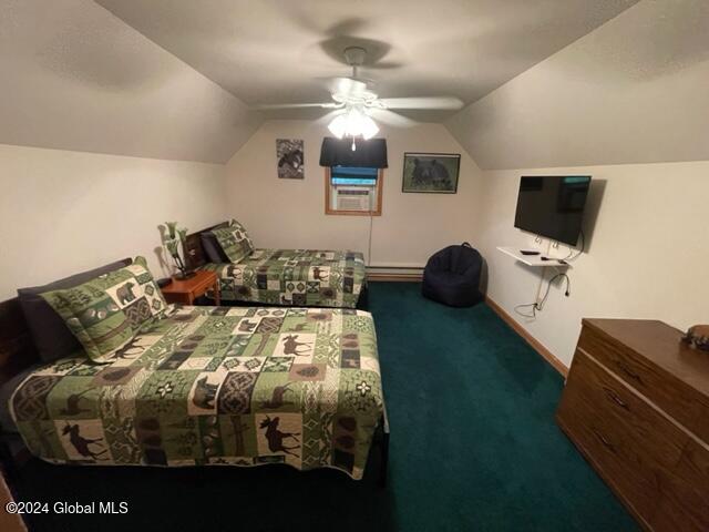 carpeted bedroom featuring vaulted ceiling and ceiling fan