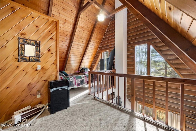 hall featuring carpet flooring, lofted ceiling with beams, wooden ceiling, and wooden walls