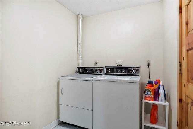 washroom with washing machine and clothes dryer