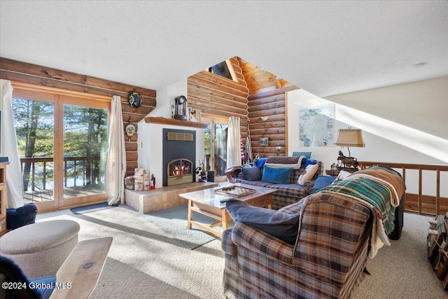 carpeted living room with log walls, a textured ceiling, and vaulted ceiling