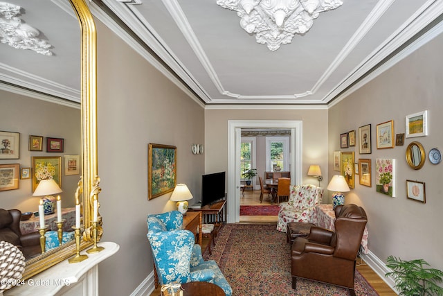 living room with hardwood / wood-style flooring and ornamental molding