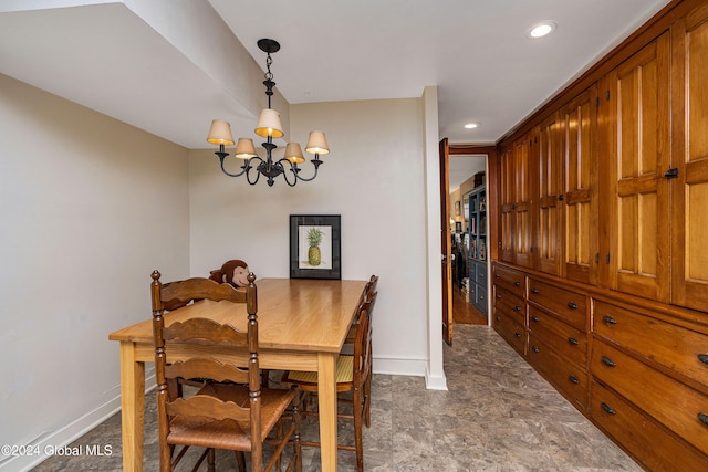 dining area featuring an inviting chandelier