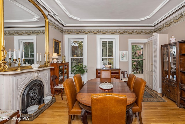 49A Dove St, Albany, NY 12210 - dining space with light wood-style floors, crown molding, and arched walkways