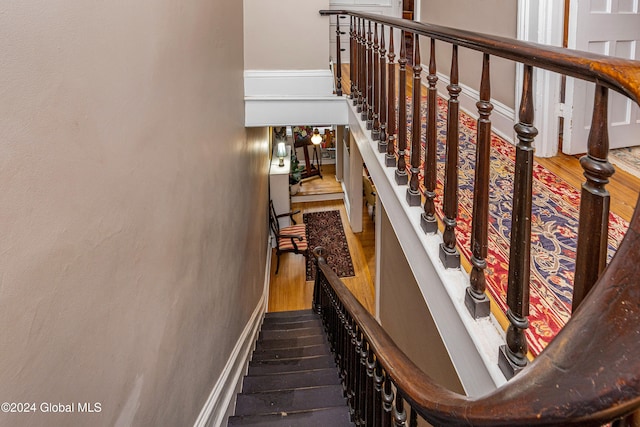 stairway with wood-type flooring