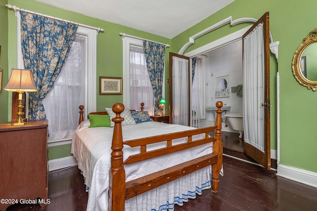 bedroom with dark wood-type flooring