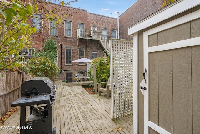 wooden terrace featuring grilling area