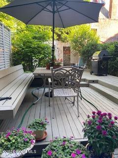 wooden deck featuring area for grilling