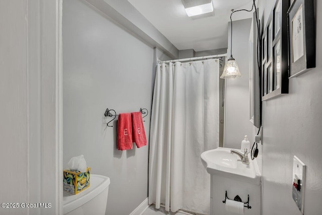 49A Dove St, Albany, NY 12210 - bathroom featuring toilet, a sink, and curtained shower