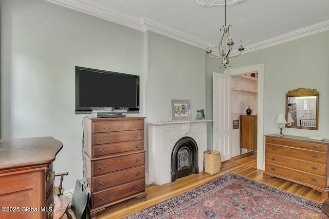 49A Dove St, Albany, NY 12210 - living room with light wood-type flooring, crown molding, a chandelier, and a fireplace