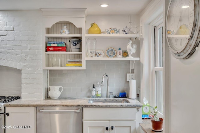 49A Dove St, Albany, NY 12210 - kitchen featuring appliances with stainless steel finishes, a sink, open shelves, and decorative backsplash