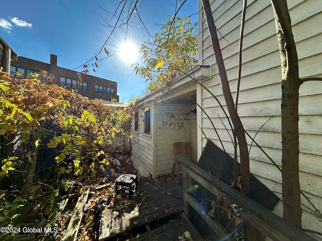 view of side of property with a deck