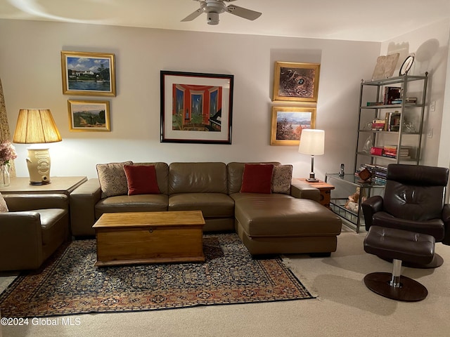 living room featuring carpet and ceiling fan