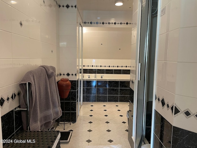 bathroom with plus walk in shower and tile walls