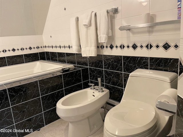 bathroom featuring tile patterned floors, a bidet, tile walls, and toilet