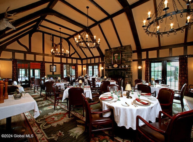 dining room featuring beamed ceiling, high vaulted ceiling, and french doors