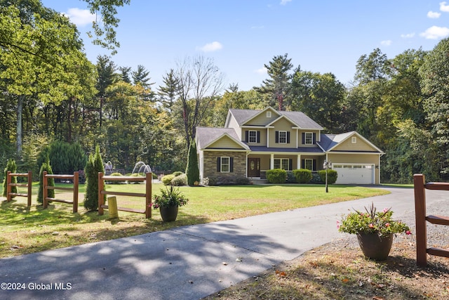 view of front of house with a front lawn and a garage