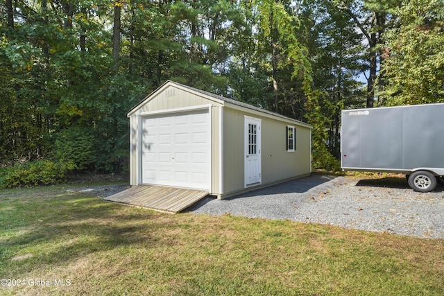 garage featuring a lawn