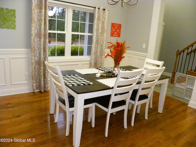 dining space featuring a chandelier and wood-type flooring